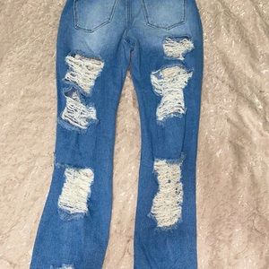 Distressed jeans could be boyfriend jeans